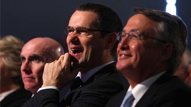 Sport lover ... Senator Stephen Conroy, centre, with NBN CEO Mike Quigley, left, and Treasurer Wayne Swan, right.