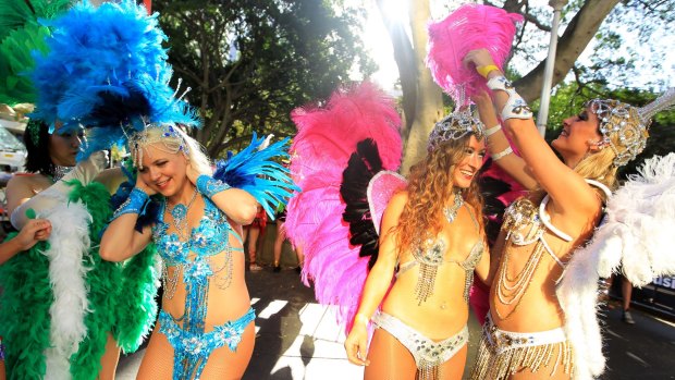 Participants prepare to put on a colourful show for the 2015 Mardi Gras at Hyde Park in Sydney.