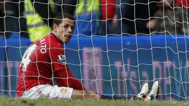 Manchester United's Javier Hernandez reacts after missing a chance to score against Chelsea during their English FA Cup quarter-final replay soccer match.