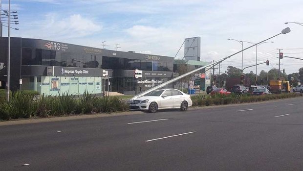 Poles apart ... The white Merecedes was pushed into a pole on the Nepean Highway at Moorabbin.