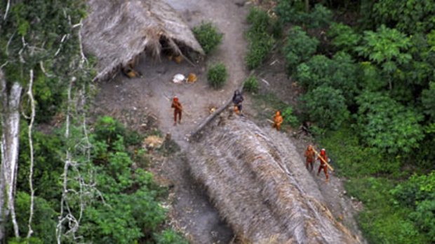 An aerial photo of uncontacted Indians in Amazon jungle.