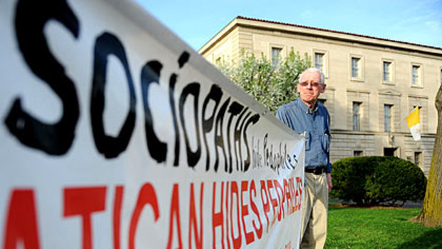 John Wojnowski with his banner.