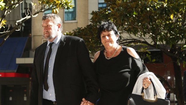 Calls for change: Phil Hughes' parents arrive at the inquest.
