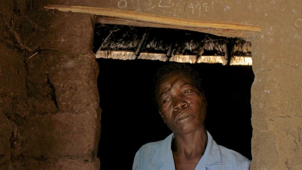 Attacked for using 'witchcraft' ... Mage Benge stands in the doorway of her home in the village of Magu in Tanzania's northern Mwanza district. 