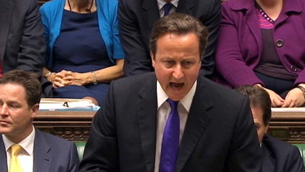 Heated ... Britain's Prime Minister David Cameron addresses parliament over the phone hacking scandal.