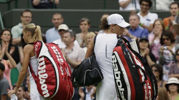 Exit Australia's final Wimbledon hope &#8230; Samantha Stosur trudges off after her second-round loss to unseeded Dutchwoman Arantxa Rus, left.