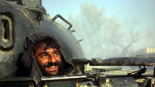 Endless conflict ... a Northern Alliance tank driver in Kabul in 2001.