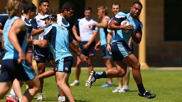 Fit again &#8230; Wycliff Palu runs the ball during a Waratahs training session yesterday at Victoria Barracks after his big Wallabies showing at the weekend.