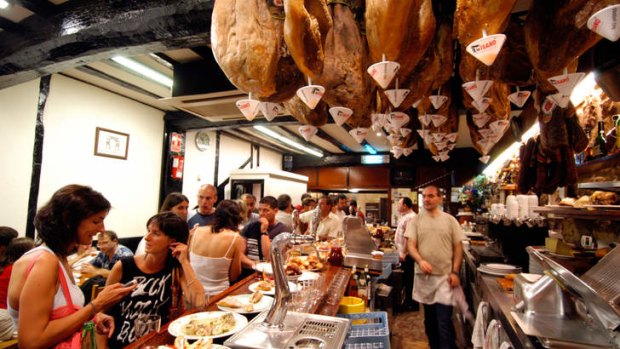 Food on the move: tapas time at one of San Sebastian's many pinxtos bars.