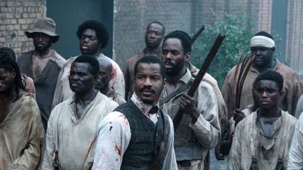 Nate Parker as Nat Turner, center, in a scene from The Birth of a Nation.