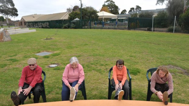 Stretch those legs: Physiotherapist Rachael Hely (right) leads Keith Allender (left), Dawn O'Neil and Catherine Allender in low impact exercise in a Geelong park.