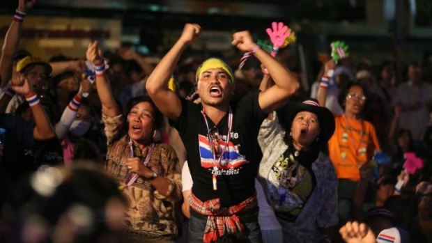 Revolt: Anti-government protesters shout slogans during a rally outside Government House on Tuesday.