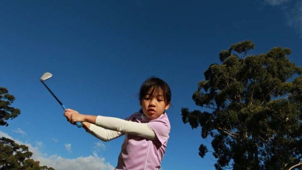 Chipper ... Sophie Yip, 7, practises at Ryde-Parramatta Golf Club in preparation for the US Kids World Championship in North Carolina this month.