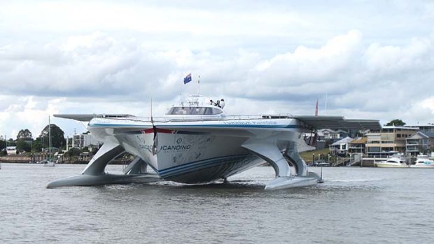 The 31-metre Turanor PlanetSolar approaches her berth at Brisbane'se Riverside Centre.