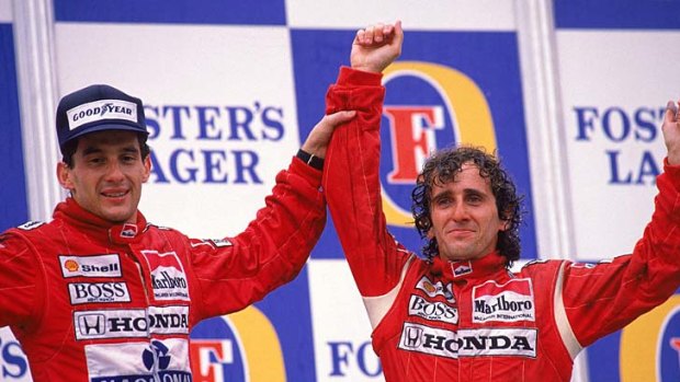 McLaren Honda driver Alain Prost celebrates his victory with teammate Ayrton Senna who finished second in the Australian Grand Prix in Adelaide in November 1988.