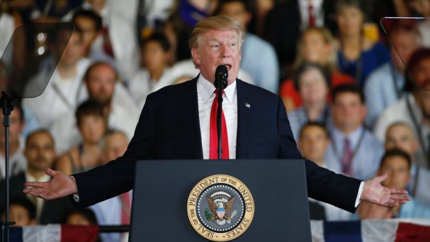 President Donald Trump delivers a speech aboard the nuclear aircraft carrier USS Gerald R. Ford on Saturday. 