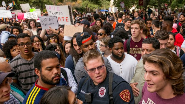 Protester Patricia Romo, left, 22, argues with Trump supporter Cody Williams, 18, during a demonstration at Texas State University in San Marcos.