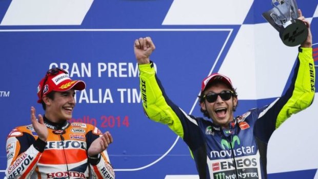 Marc Marquez and Valentino Rossi celebrate on the podium after the Italian MotoGP.