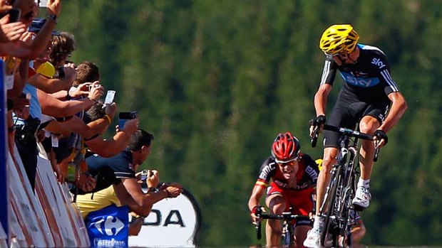 Away ...  Chris Froome of Great Britain makes the decisive break over Cadel Evans.
