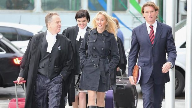 Up for the fight: Suspended coach James Hird and wife Tania arrive at the Federal Court with their legal team.