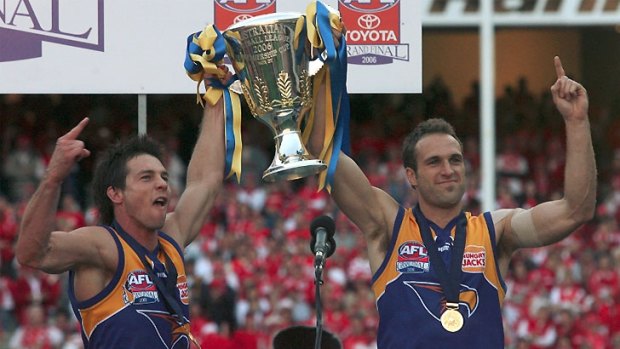 Ben Cousins and Chris Judd hold the Premiership Cup.