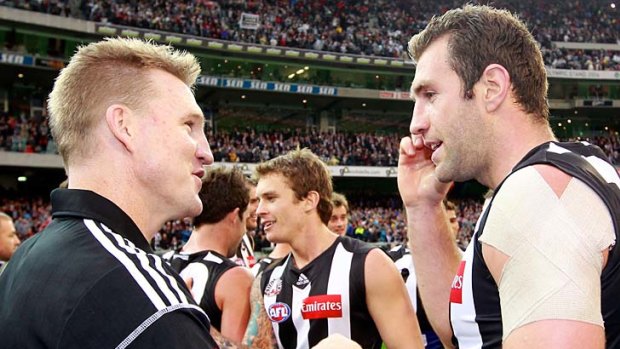 Nathan Buckley and Travis Cloke after the Magpies' win over Essendon earlier this season.