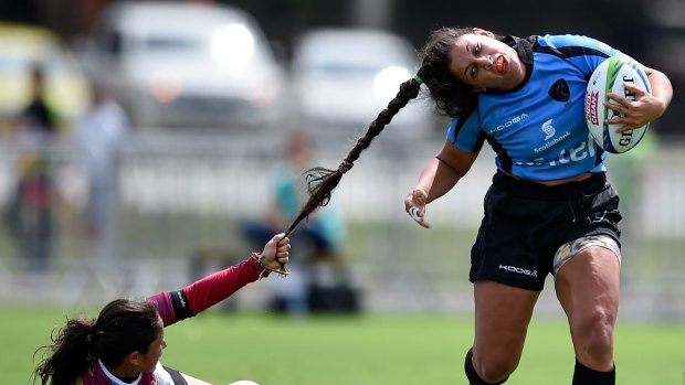 Maryoly Gamez of Venezuela battles for the ball against Victoria Rios of Uruguay during the International Women's Rugby Sevens – Aquece Rio Test Event for the Rio 2016 Olympics at Deodoro Olympic Park on March 6 in Rio de Janeiro, Brazil. 