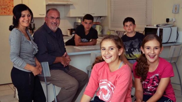 ''The pudding hasn't risen very often recently'' &#8230; Rima and Mark Geerin with their four sports-loving children at home in Glenmore Park.