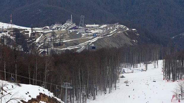 A view from near the alpine course showing the difference between the snow covered piste and the snowless lower slopes at Sochi.