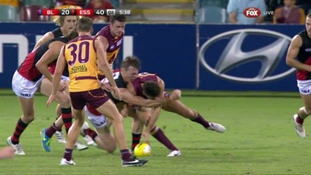 Brisbane's Andrew Raines makes high contact to Essendon's Brendon Goddard.