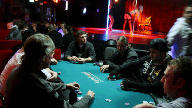 A group of men enjoy a game of pub poker at Brunswick's Hustler Club.