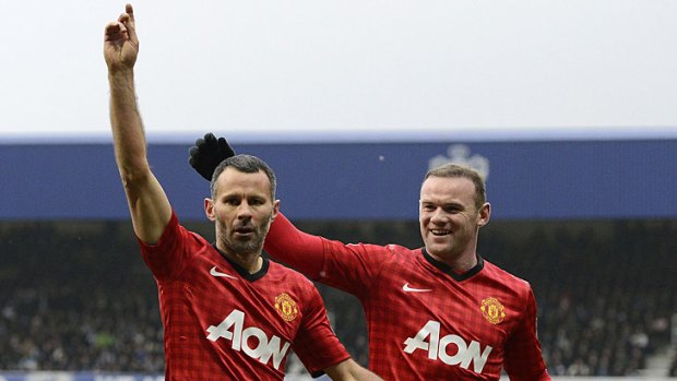 Ryan Giggs celebrates scoring with Wayne Rooney during the English Premier League football match between Queens Park Rangers and Manchester United last weekend.