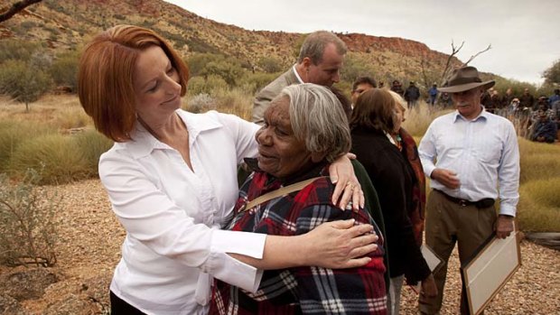 Prime Minister Julia Gillard with aboriginal elder Alice Ngalkin who was overcome with emotion at a native title ceremony at the Alice Springs Desert Park.