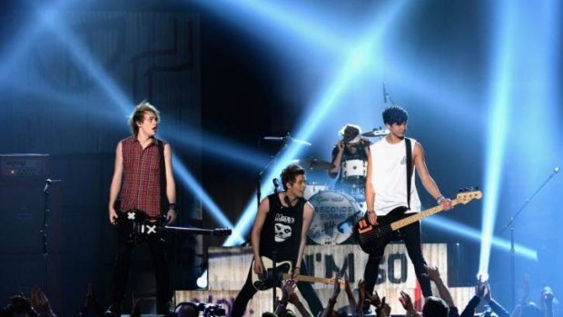 Red hot: Sydney band 5 Seconds of Summer perform at the Billboard Awards.