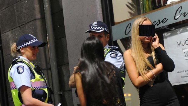 Police question two underage girls in Melbourne's nightclub district.