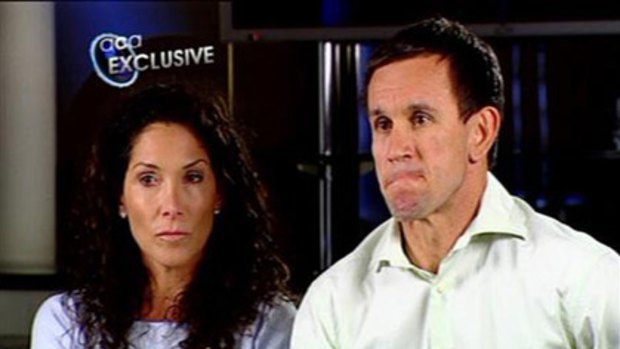 'I did not commit an act of abuse' ... Matthew Johns and wife Trish.
