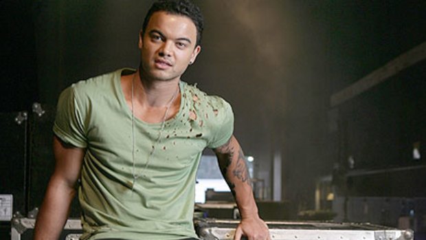 In a bizarre misunderstanding, singer Guy Sebastian was arrested at gunpoint in LA for stealing his own car.