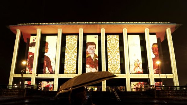 The National Library of Australia is illuminated for the Enlighten Festival. The artist who created the projection was Paul Summerfield.