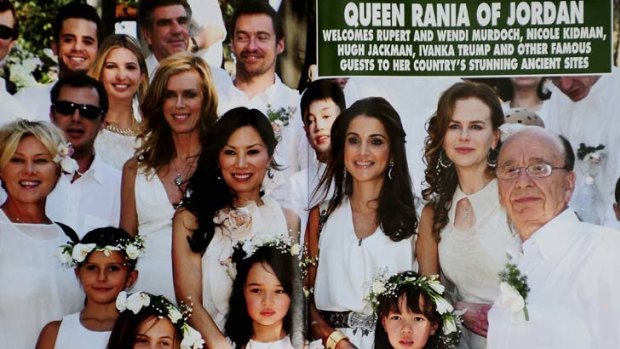 All smiles ... Hello magazine's coverage of the Murdoch daughters' baptism in Jordan.