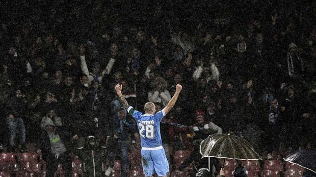 Napoli's captain Paolo Cannavaro celebrates after scoring against Catania.