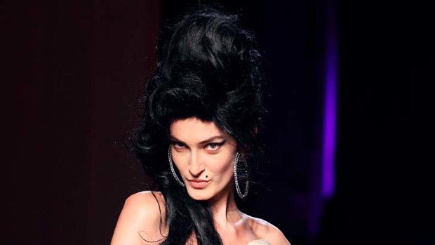 A model presents a creation by French designer Jean Paul Gaultier inspired by Amy Winehouse.