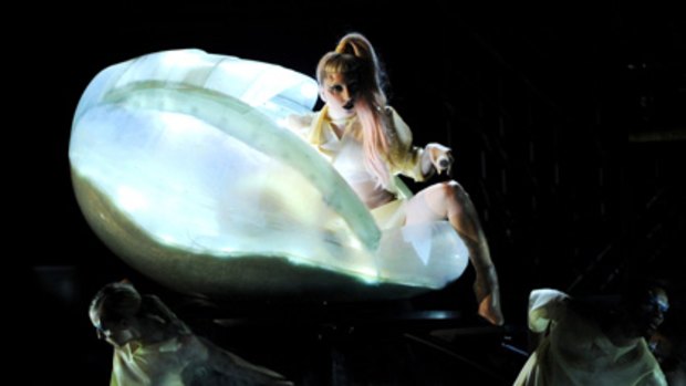 Lady Gaga emerges from the 'womb'.