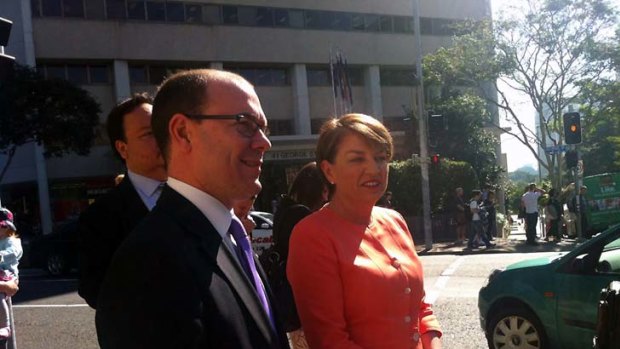 Premier Anna Bligh walks Treasurer Andrew Fraser to Parliament House this morning.