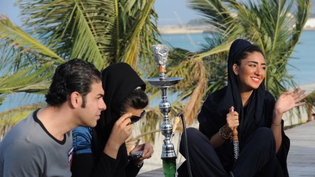 Defying expectations: Relaxing at a cafe in the beachside town of Kish in Iran.