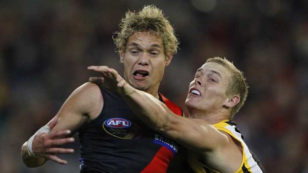 Essendon's Leroy Jetta and Richmond's Mitch Farmer battle for the ball in a game last year.