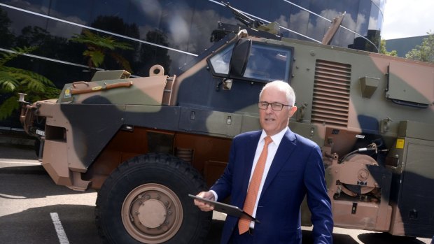 Prime Minister Malcolm Turnbull is pictured with a Bushmaster armoured vehicle at Thales Defence Exports in Sydney on Monday.