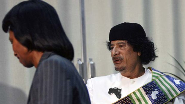 "Weird obsession" ... Libyan leader Muammar Gaddafi, right, receives US Secretary of State Condoleezza Rice in Tripoli in 2008.