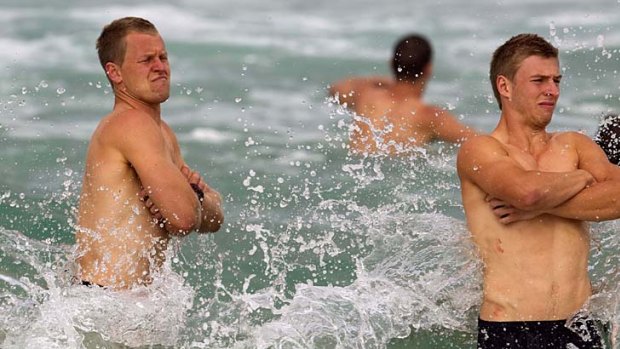Making a splash: Swans Ryan O'Keefe and Kieren Jack at a Bondi Beach recovery session yesterday.