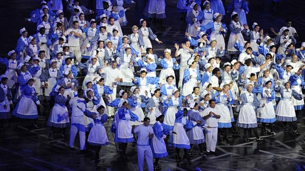 Nurses from the GOSH - Great Ormond Street Hospital perform during the opening ceremony.