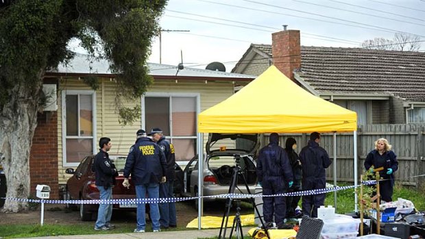 Police raid a property during 'Operation Neath' in 2009.